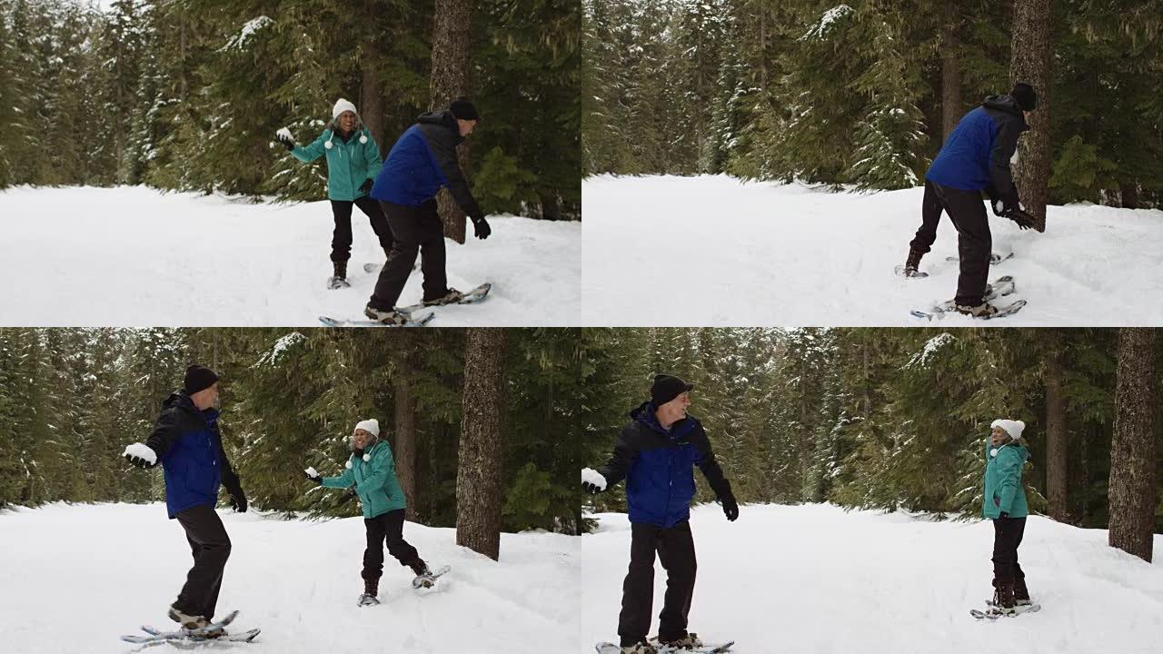 有趣的老年夫妇打雪仗
