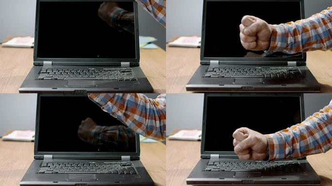 SLO MO LD男子用拳头砸碎笔记本电脑并将其折断