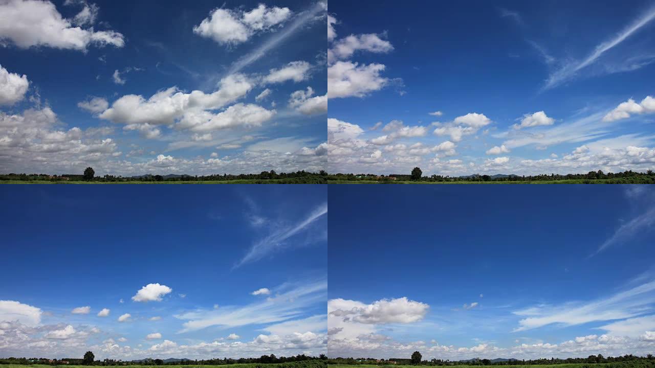 云彩的天空在牧场随风移动。