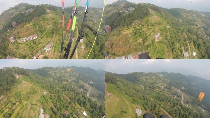 高山稻田上方的第一人称透视滑翔伞