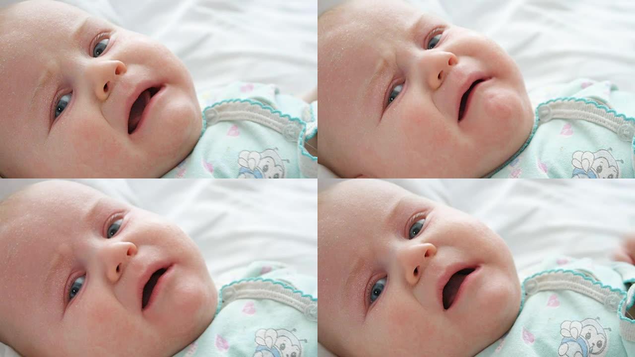 婴儿在哭，看着相机