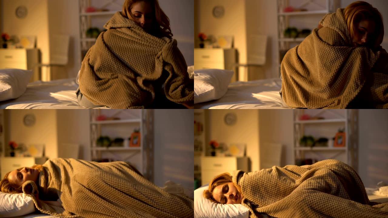 生病的女性躺在床上盖着毯子，发热症状，流感无力