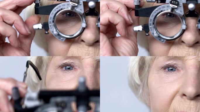 女性养老金领取者通过phoropter检查视力，眼科检查