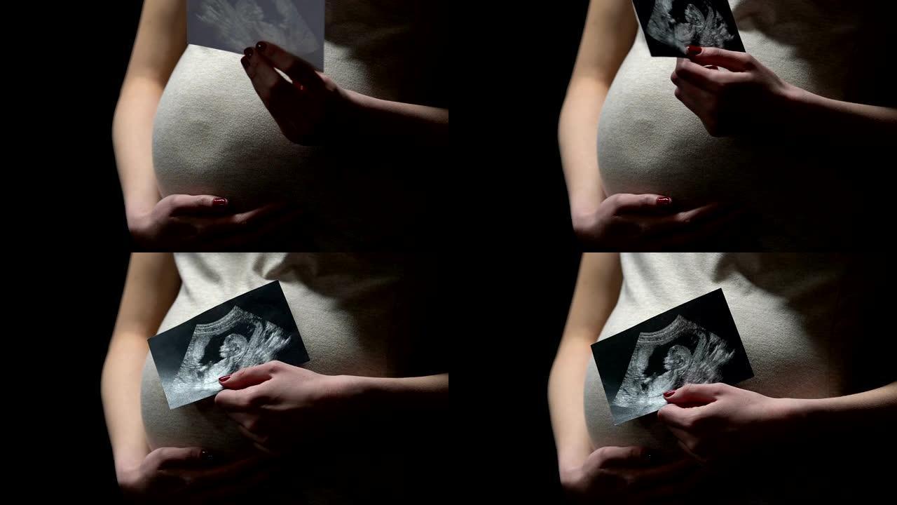 快乐孕妇显示超声波图像，产前护理，健康婴儿