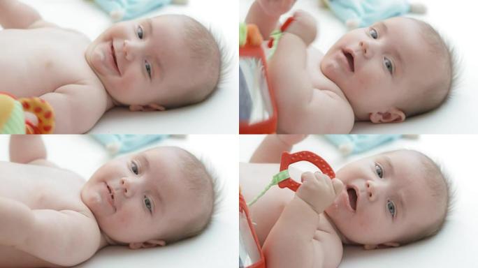 婴儿男孩在发出声音时微笑和流口水