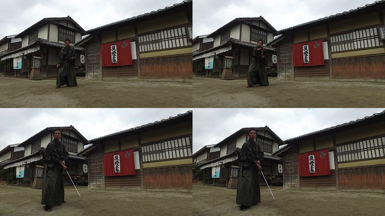 日本武士在乡村街道上拿着剑