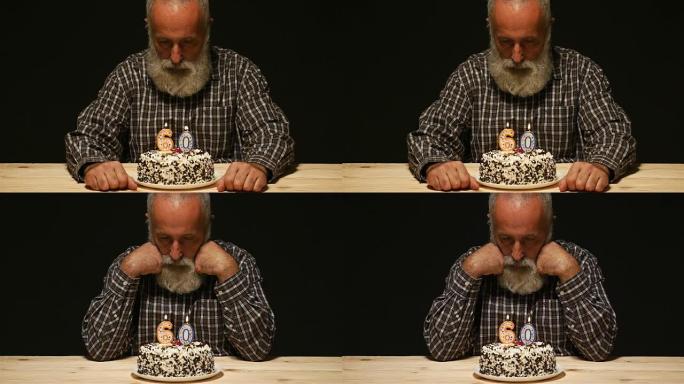 周年纪念蛋糕上有悲伤表情的老人