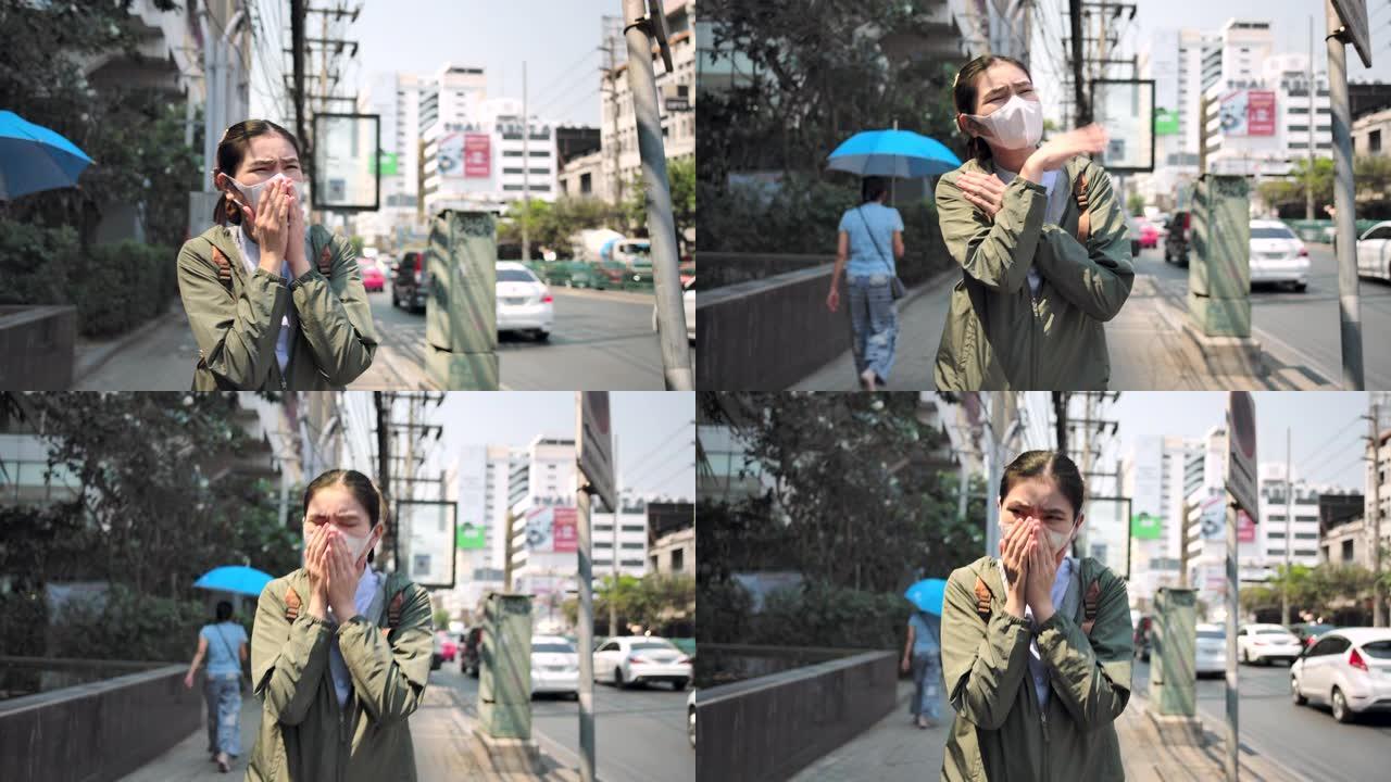 4k亚洲女性戴着鼻罩，防止空气中PM 2.5灰尘和新型冠状病毒肺炎病毒。