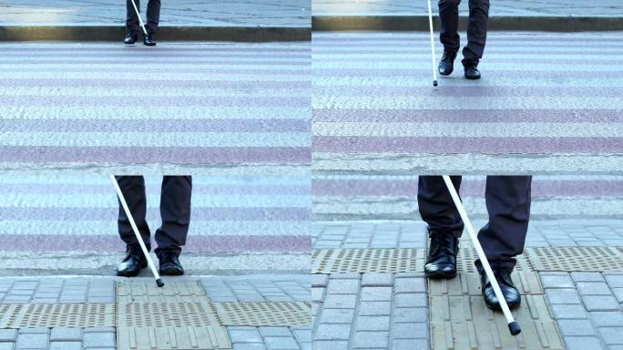视力障碍男子使用特殊手杖在触觉人行横道上行走