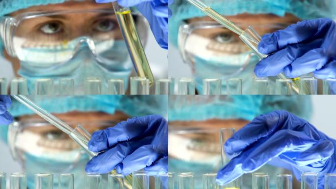 实验室专家在试管中的尿液样本中添加化学试剂，进行健康检查