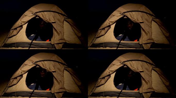 痛苦的黑人在帐篷里哭泣，无家可归的难民生病和饥饿的营地
