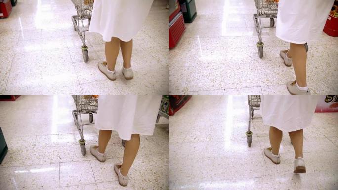 后视图: 在超市购物的女人