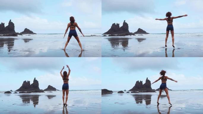 跳跃深蹲-适合女性训练腿部与hiit锻炼跳跃深蹲练习。健身训练在夏季海洋白色沙滩上做有氧运动做爆炸跳