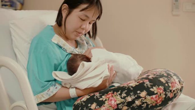 母亲在医院母乳喂养新生婴儿