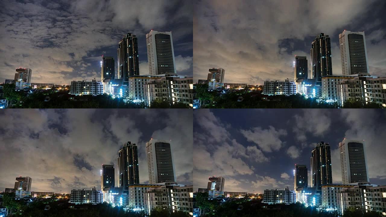 4k延时宽镜头: 夜间云层覆盖的城市景观