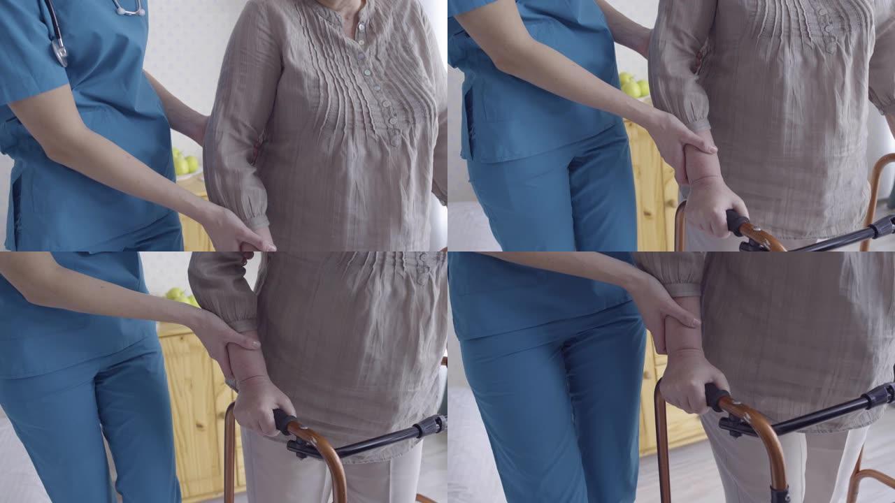医务人员帮助残疾老妇与助行器一起移动，医疗保健
