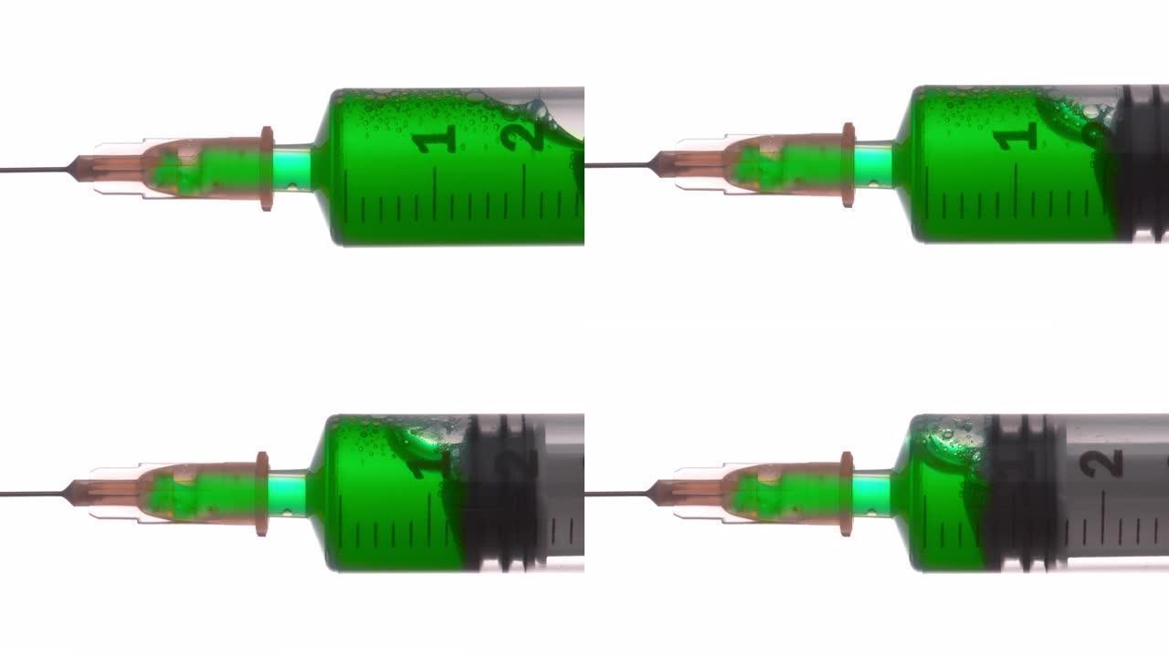 SLO MO绿色液体被压出注射器