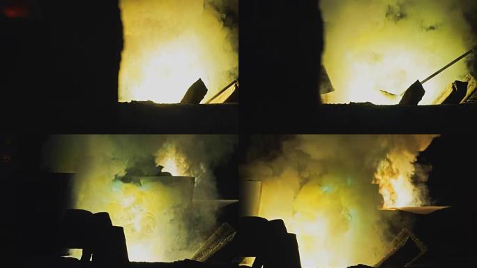 2多莉从高炉射出分层的白烟和火。在铸铁厂加工钢材。