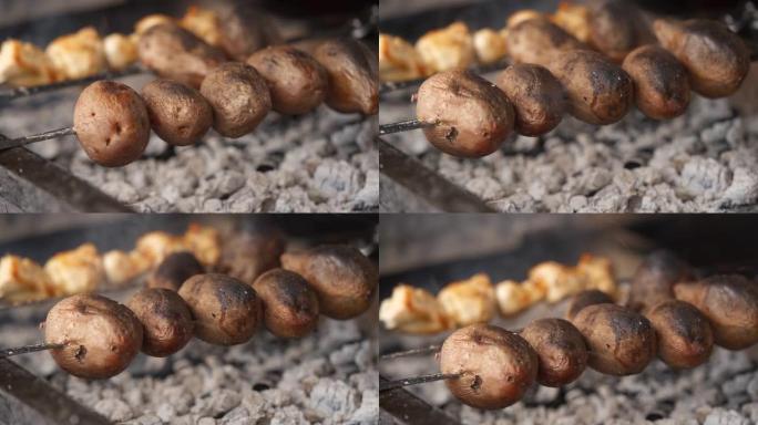 在山上的烤架上煮土豆的细节照片
