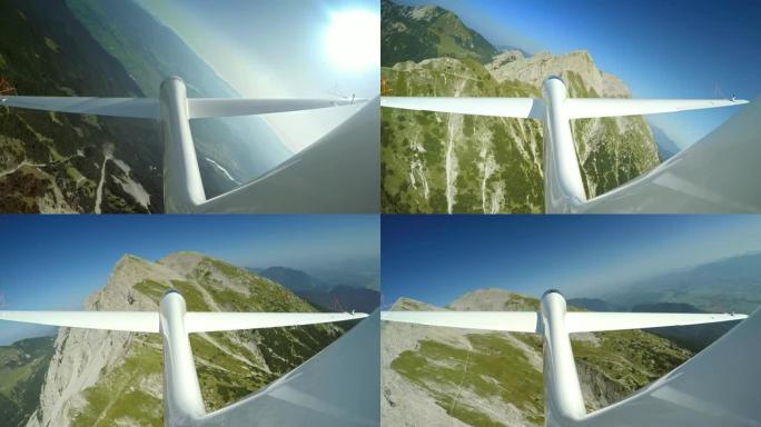 在阳光明媚的日子里，LD滑翔机在绿色的山脊上航行