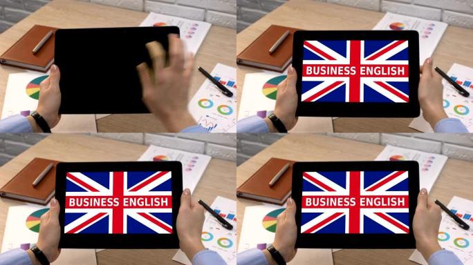 商务英语app against british flag on tablet in female h