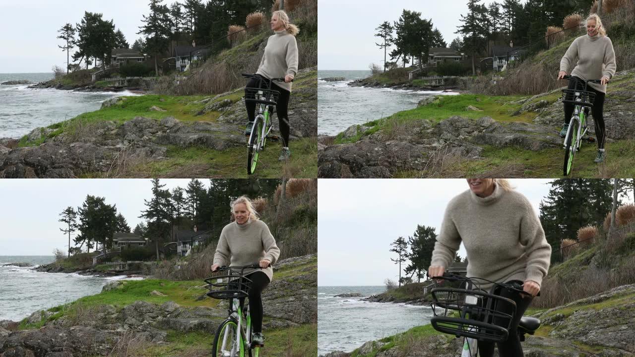 女人沿着沿海小路骑自行车