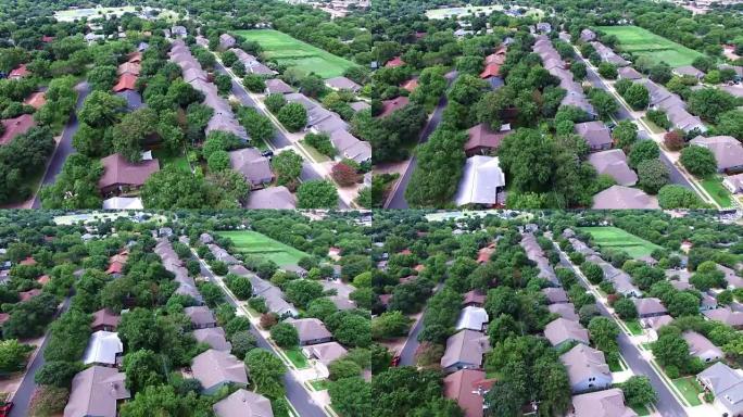 空中: 飞越德克萨斯州奥斯汀当地的住宅区，拥有天然树木和德克萨斯山乡村的感觉