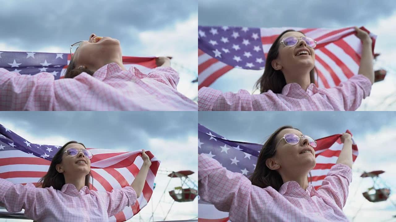 妇女挥舞着美国国旗，爱国者，为他们国家的年轻人确保未来