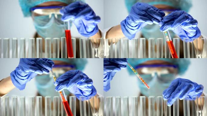 研究人员用石蕊试纸测量红色液体物质中的ph值，测试