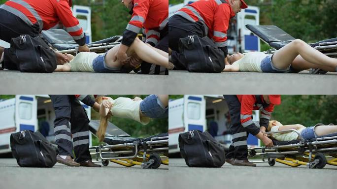 救护车服务人员使用担架将昏迷的女孩送往救护车