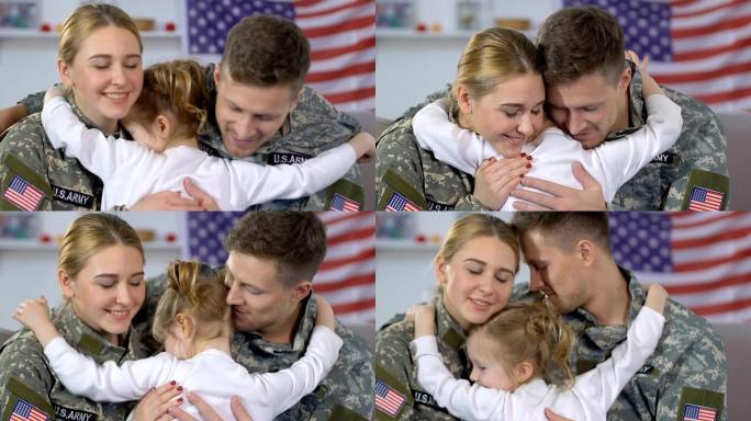 年轻的军人夫妇拥抱女儿，家庭关系，回家的幸福