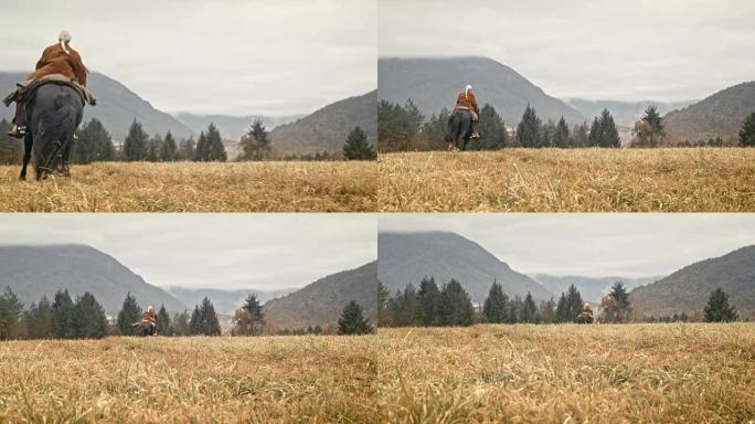 SLO MO牛仔女郎在山上草地上疾驰