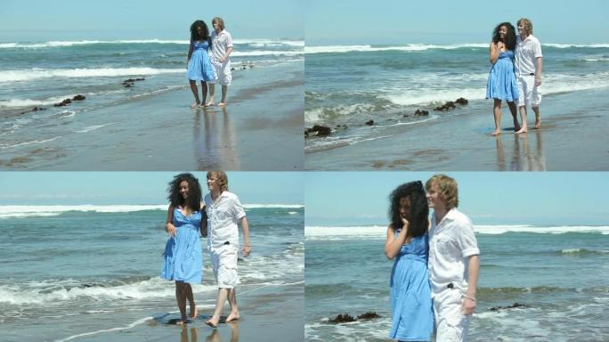 夫妇一起沿着海滩散步