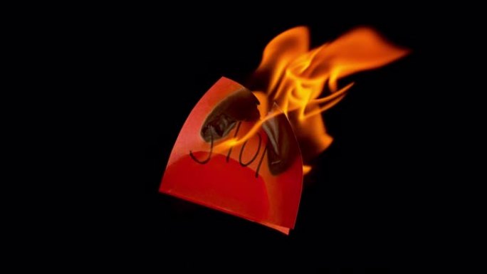 在火焰中消失的红色纸上的SLO MO LD “停止” 铭文