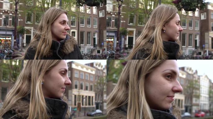 在荷兰阿姆斯特丹散步的金发年轻女子