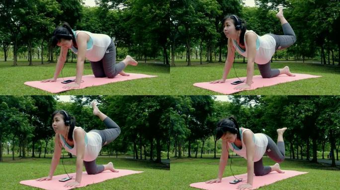 孕妇在公园练习瑜伽