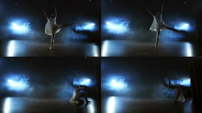 现代芭蕾舞的戏剧性场面，穿着白色连衣裙的孤独芭蕾舞演员使用现代编舞表演舞步