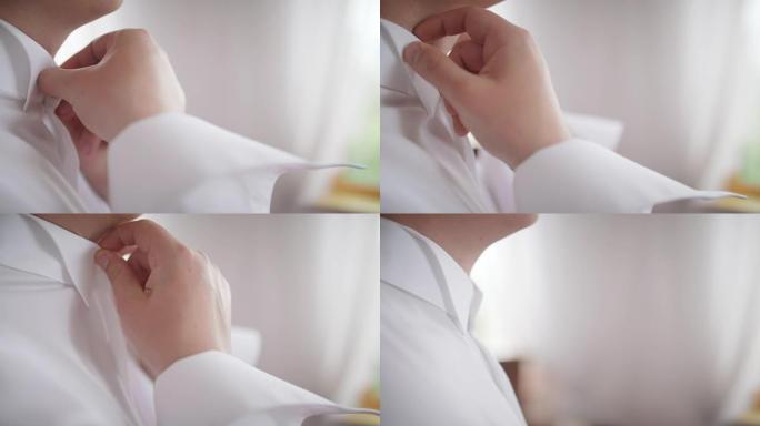 年轻的新娘礼服和衬衫纽扣。婚礼当天快乐的年轻新郎。