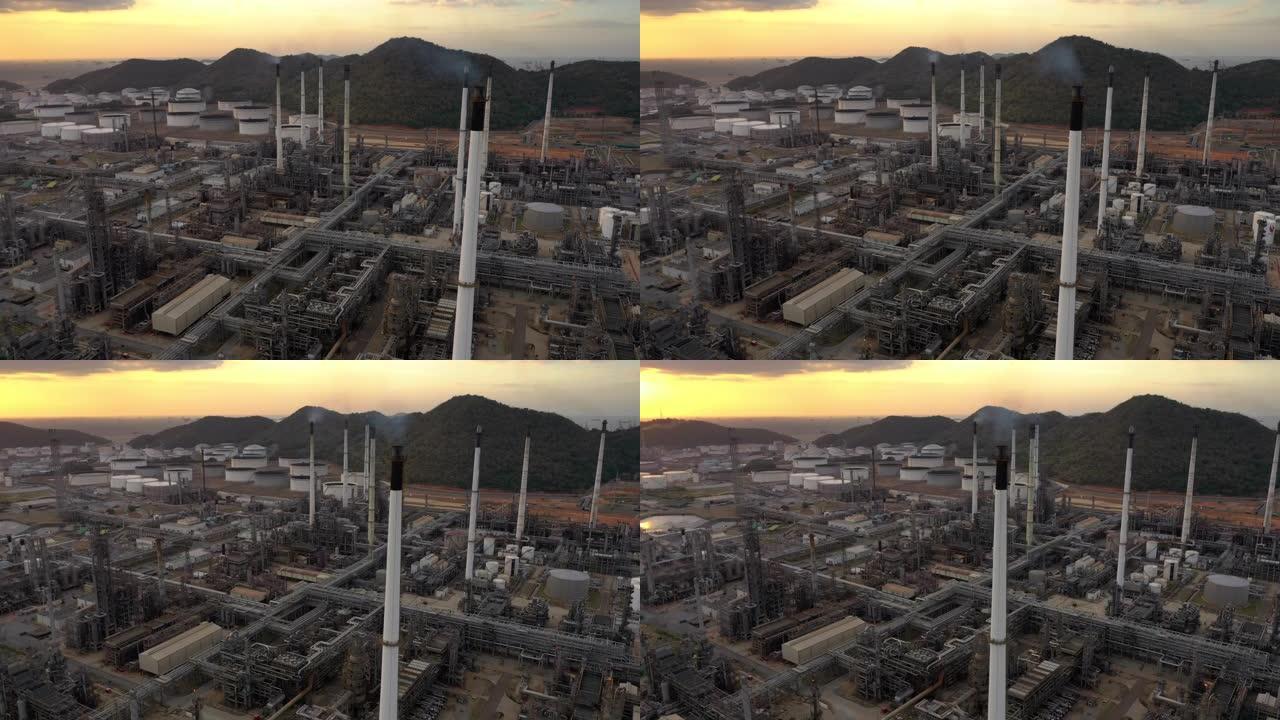 Dolly right: 日落时间的石油和天然气工业炼油厂的天然气管