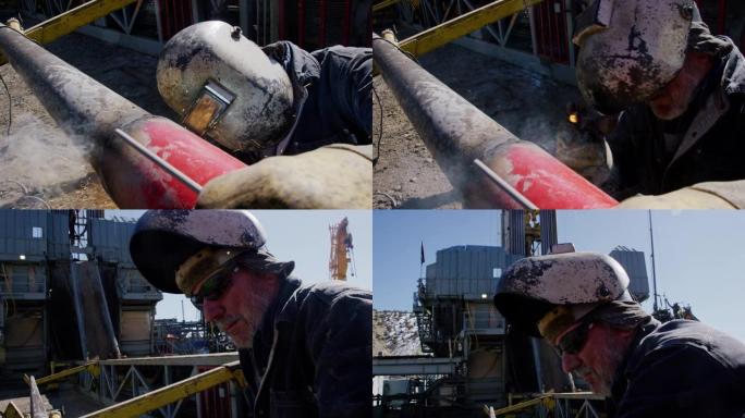 一名60多岁的男性油田工人的慢动作镜头，将两根管道焊接在一起，火花在井架旁飞舞，然后在晴天拉起焊接面