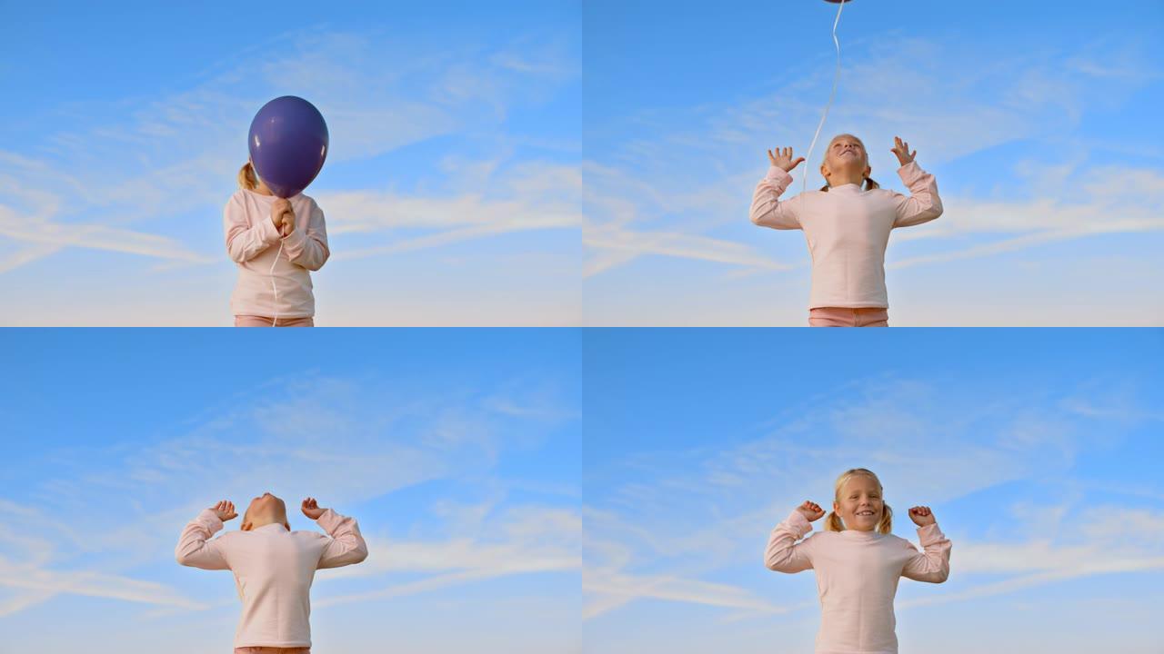 SLO MO小女孩放开紫罗兰色的气球，仰望天空，微笑着