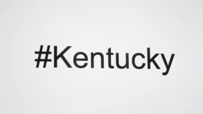 一个人在他们的计算机屏幕上键入 “# Kentucky”，然后跟随状态缩写