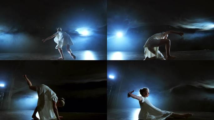 现代芭蕾舞的戏剧性场面，穿着白色连衣裙的孤独芭蕾舞演员使用现代编舞表演舞步