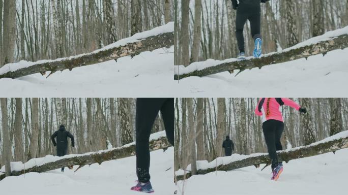 冬天，一个男人和一个女人在公园里奔跑，跳过一棵倒下的树。越过障碍物