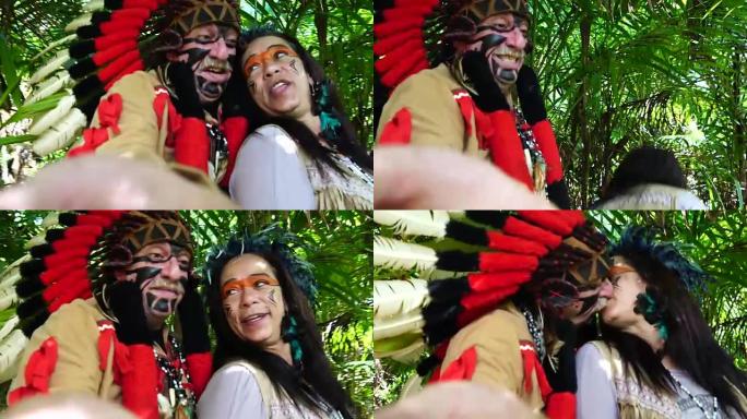 旅游夫妇装扮成土著人在雨林中自拍照