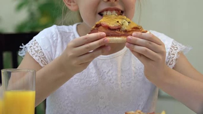 年轻女孩吃油炸脂肪比萨饼，不健康的营养，胃炎的风险