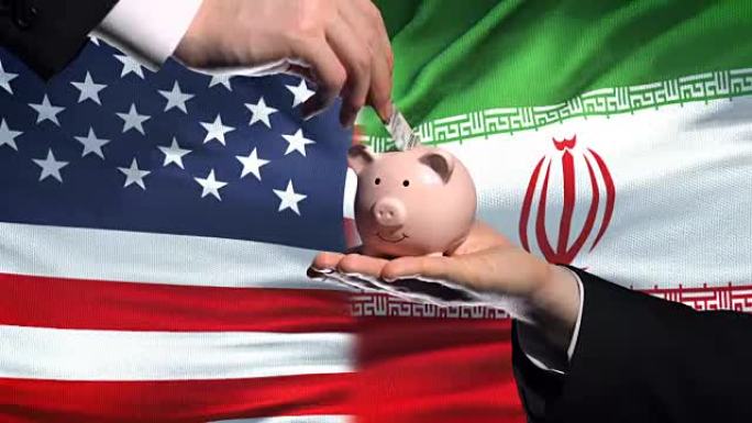 美国在伊朗的投资，手把钱放在存钱罐里的旗帜背景