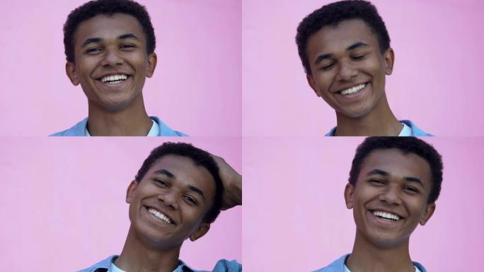 美国黑人少年男孩在镜头前微笑和调情的特写镜头，受欢迎程度