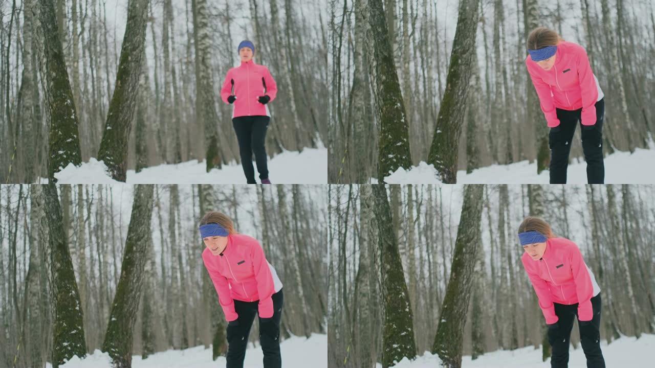 一个年轻的女人在冬天的森林里慢跑，累了，停下来喘口气。他恢复了体力，克服了乏力，继续奔跑。坚持不懈，