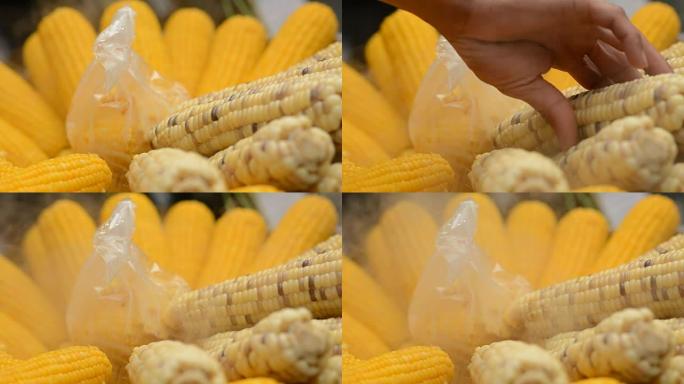 蒸玉米和手食物健康饮食味美可口